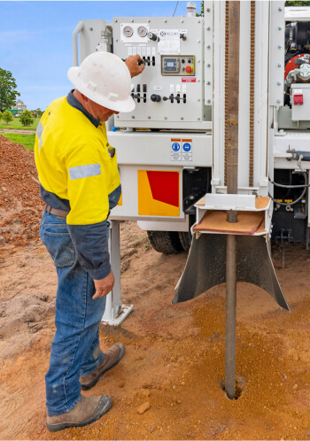 Drill rig operator working at site